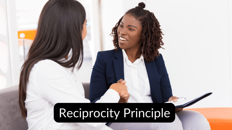 Two women showing reciprocity